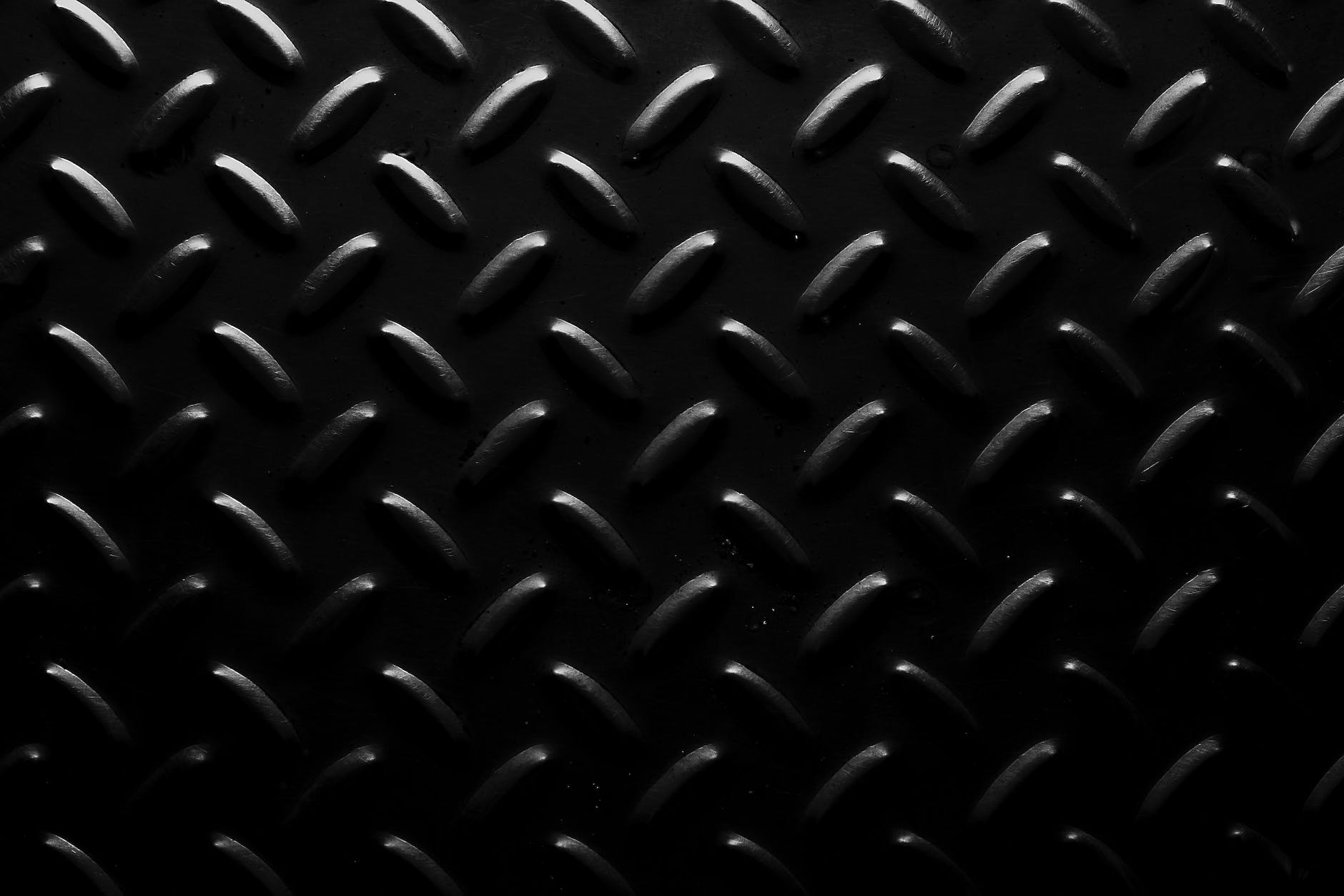 dark background with uneven metal surface
